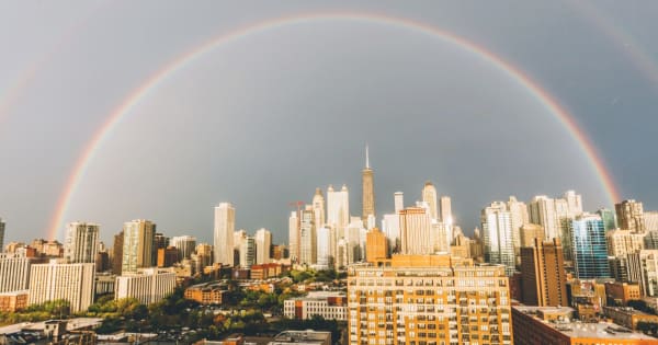 Chamber community tragedy: image of a city and a rainbow to illustrate recovery.