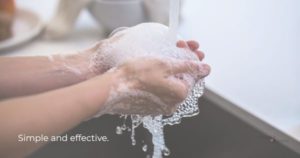 Person washing hands to illustrate an important chamber pandemic response habit.