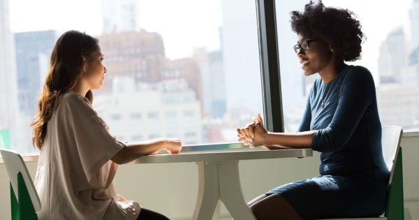 Woman interviewing or networking in a job search after COVID.