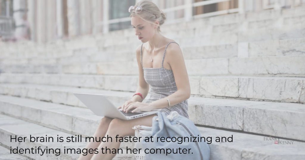 Woman with a laptop: her brain is faster than the computer is about recognizing and identifying images.