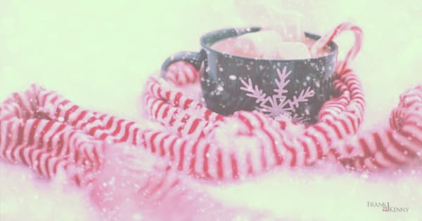Image of candy cane striped scarf and mug of hot chocolate with marshmallows.
